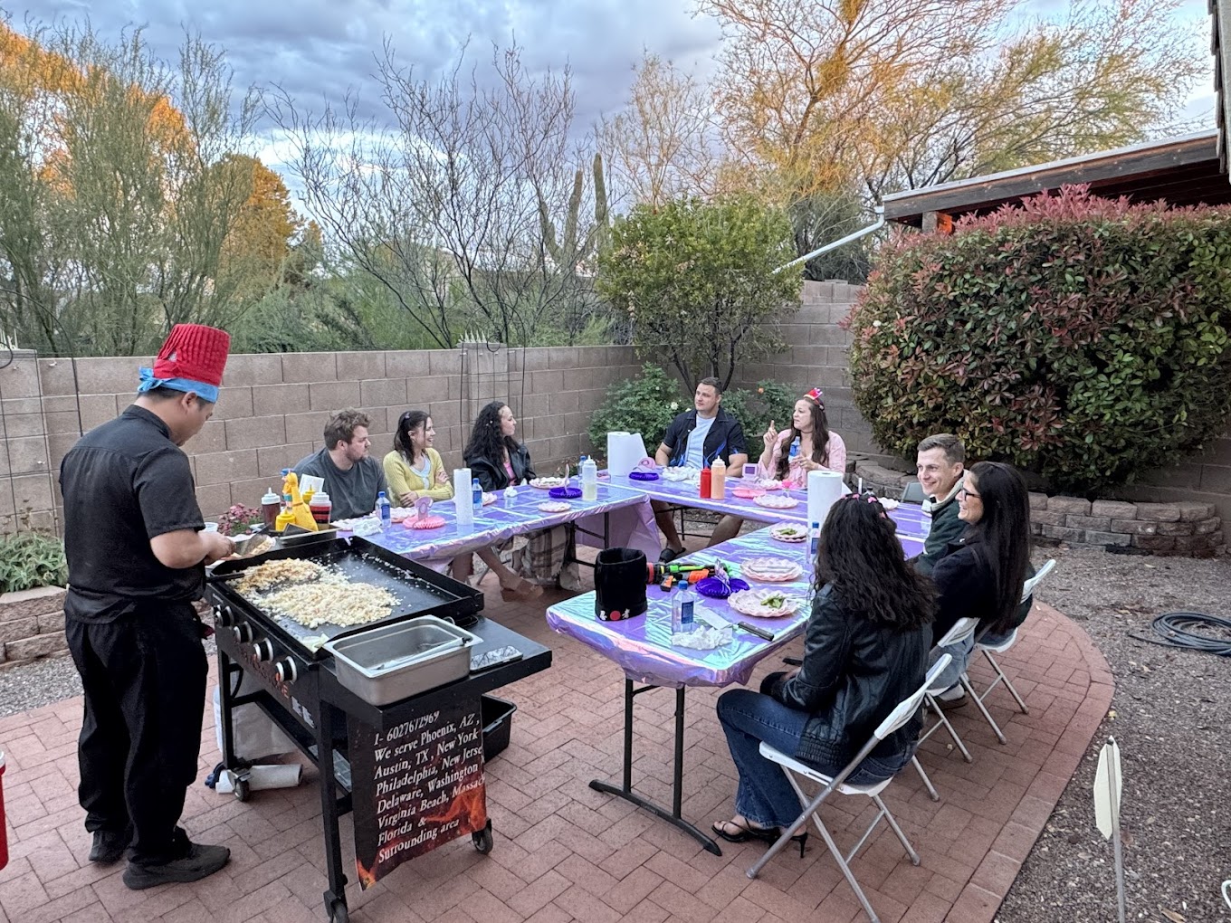 Hibachi chef cooking teppanyaki at a Boerne home gathering