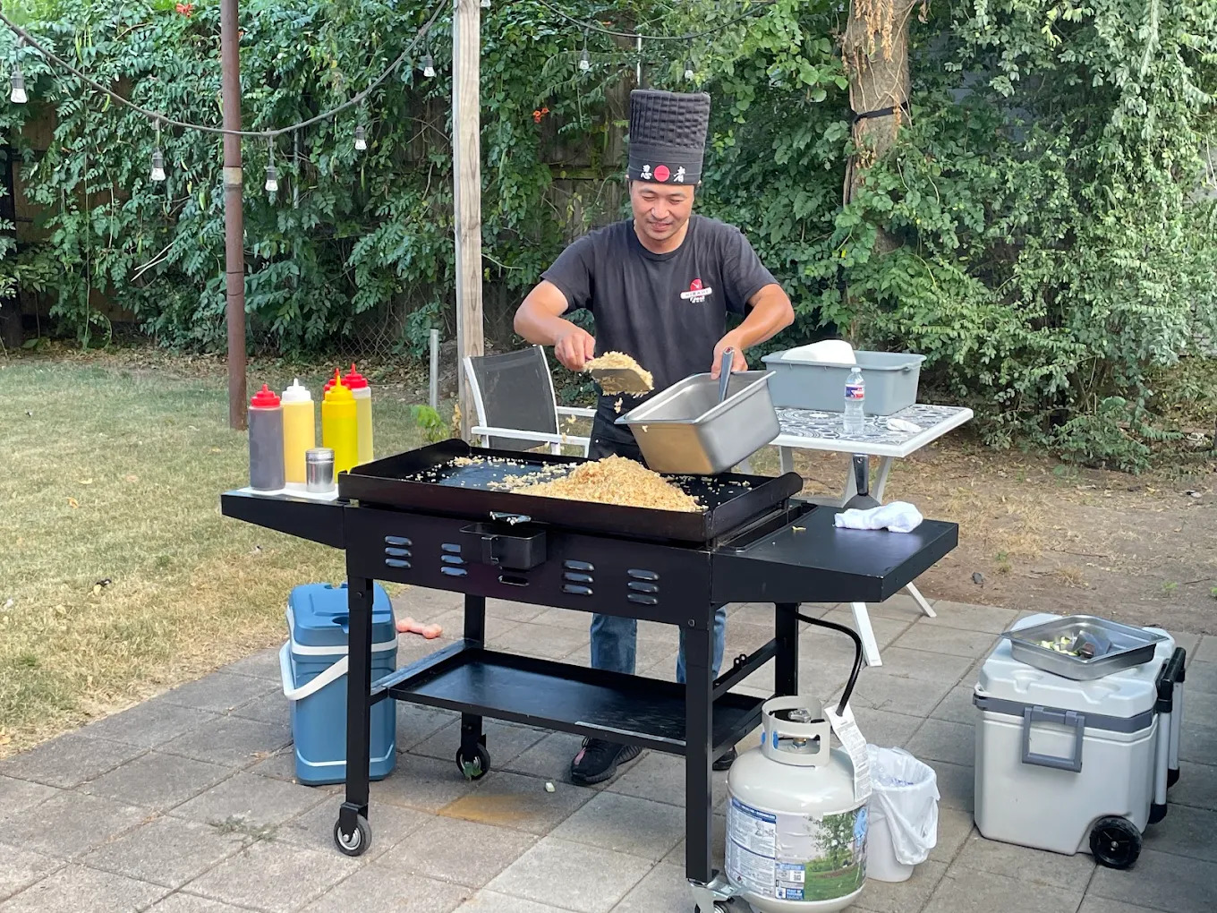 Private hibachi chef cooking at a backyard event in Brookline, Massachusetts